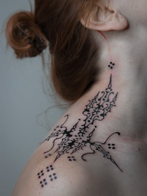 Ornamental neck and shoulder tattoo by Zuzana Mala
